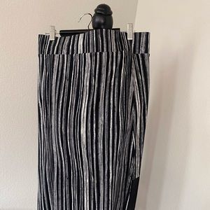 DKNY long black & white striped lightweight skirt. Has front angled split